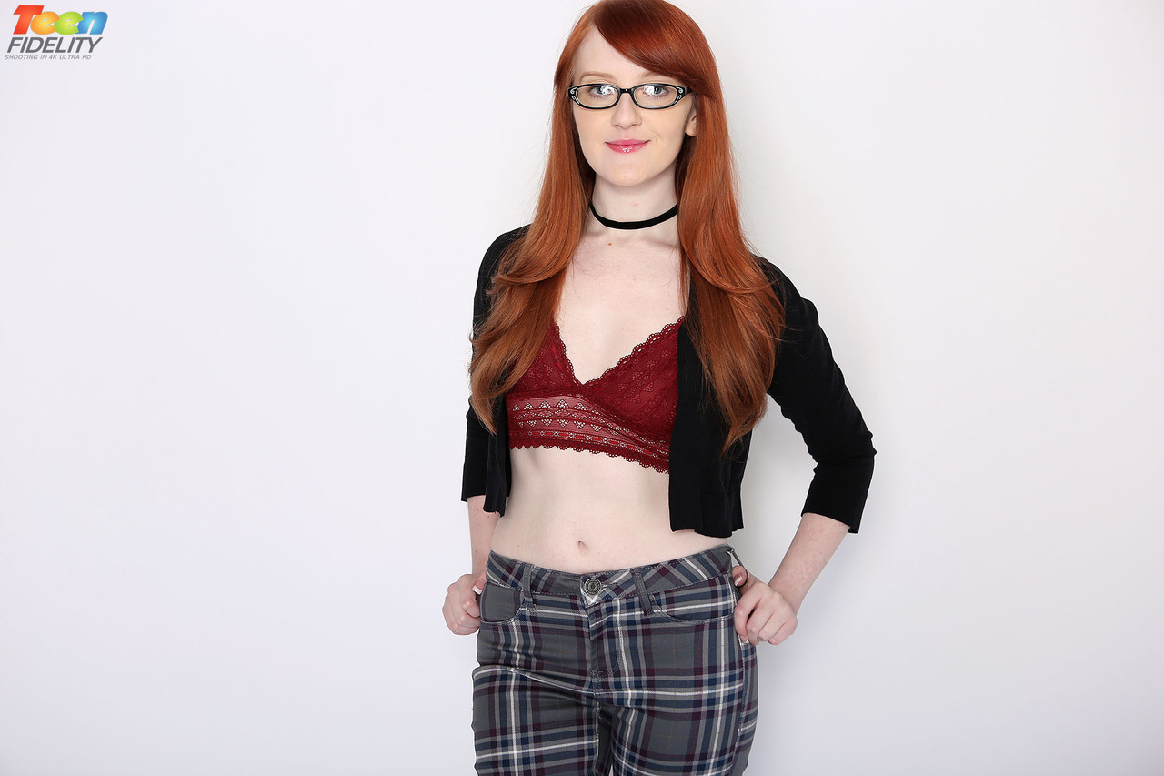Nerdy redheaded teen Krystal Orchid gets penetrated by a large cock after  